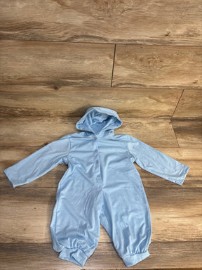 Light blue hooded baby romper with buttons, long sleeves, and cuffs on wood background