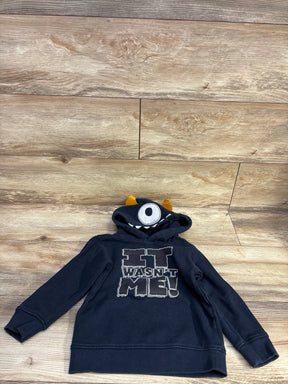 Front view of navy Kids Headquarters hoodie size 4T showing It Wasn't Me graphic and monster hood with single eye and horns