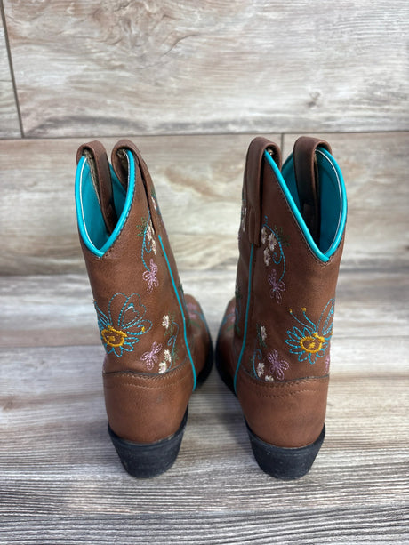 Rear view of Shyanne floral embroidery western boots (child size 10C) showcasing stitched flowers and turquoise piping and lining on a light wood floor