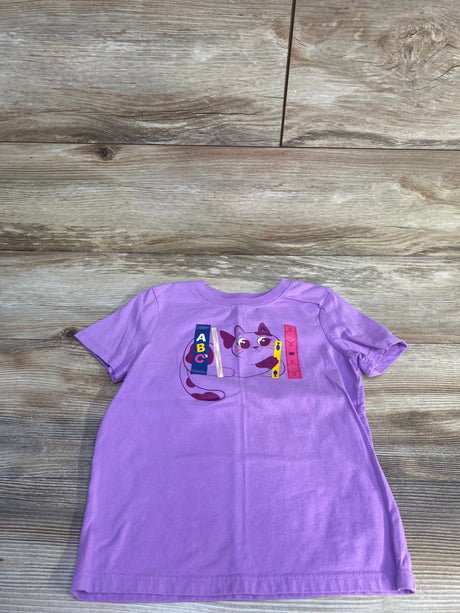 Flat lay of lilac girls' Cat and Jack short-sleeve t-shirt showing front cat and ABC book graphic on wood background