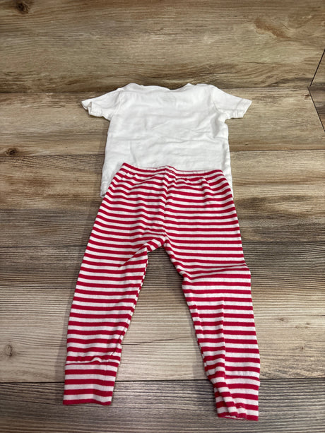 Flat lay of Carter’s 2-piece pajama set, size 12 months, with white top and red-and-white striped pants on wood