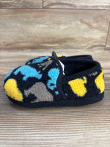 Colorful fleece baby slipper with blue, yellow, and gray pattern on wood background