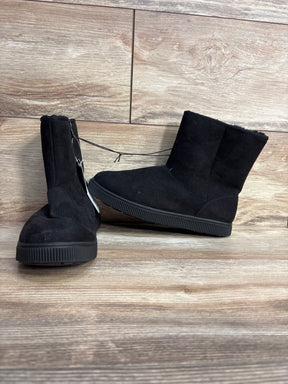 Black suede kids boots with rubber soles displayed on wood background