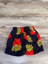 Front of Appaman black swim trunks with yellow french fry print, elastic waistband and back pocket on wood background