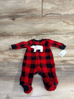 Red and black plaid baby sleeper with white bear applique, footed, on wood background