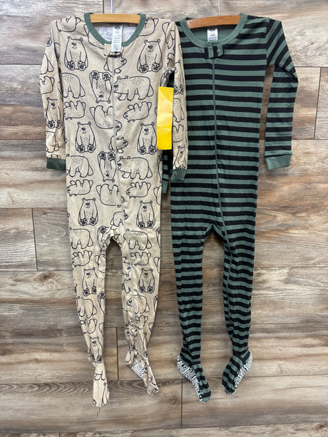Front view of two Gerber Sleep N Play sleepers with animal prints, green stripes, zippers, and foot coverings on wood floor
