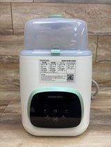 Front view of Momcozy KleanPal Pro baby bottle washer, sterilizer and dryer with translucent lid and control panel