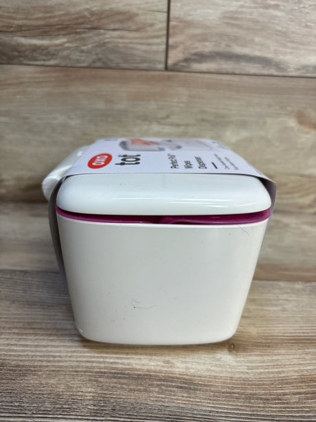 OXO Tot Perfect Pull Wipes Dispenser with purple accent on wood surface