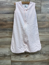 Front view of Yoga Sprout sleep sack (0-6M) with sleeveless design, center zipper and light pink fabric on wood backdrop