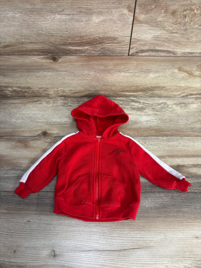 Red toddler fleece hoodie with white stripe on sleeves and kangaroo pocket on wooden floor