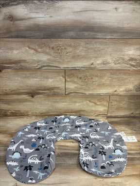 Top view of Boppy nursing pillow cover in Grey dinosaur print showing U-shaped design and zip opening on wood floor background