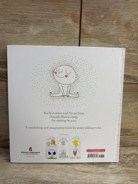 Back cover of Hello in There! hardcover children's book with baby illustration, blurb text and publisher logo on wood