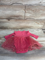 Pink infant tutu bodysuit with gold polka dots on wooden background