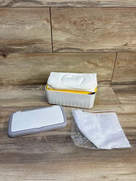 Reusable baby wipes in white container with lid and mesh bag, ideal for eco-friendly parenting