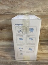 Front of NEW Larex 4-in-1 Baby Bottle Sterilizer and Dryer box showing illustrated step-by-step instructions on wood background