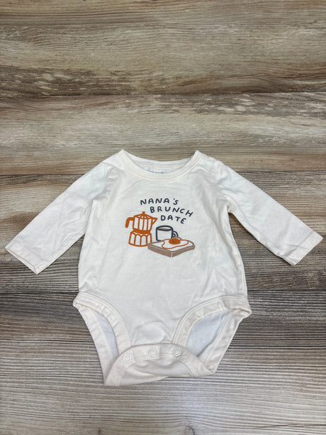 Front view of Carter’s Nan’s Brunch Date bodysuit in cream, showcasing long sleeves, snap closures, and brunch graphic on wood