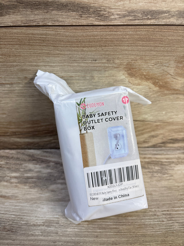 Front view of Eudemon baby safety outlet cover box showing clear plastic outlet cover image on label with wooden background