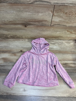 Pink Juicy Couture kids hoodie with logo print, laid on wood floor