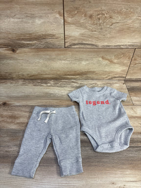 Flat lay of Carter's 2-piece gray waffle-knit bodysuit and pants (3M) showing red legend text and ribbed texture on wood