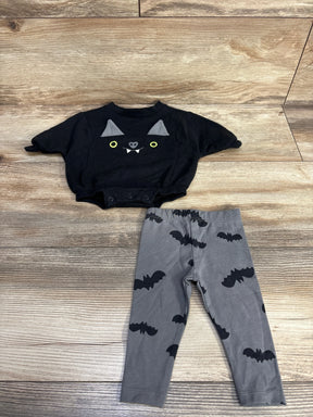 Black cat face onesie with gray bat print leggings, Halloween baby outfit on wood floor