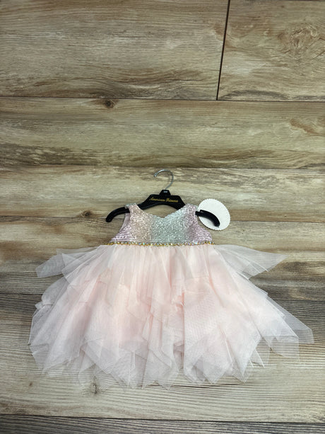 Front view of a pink size 3M sleeveless sequin dress and bloomers showcasing a layered tulle skirt on a hanger