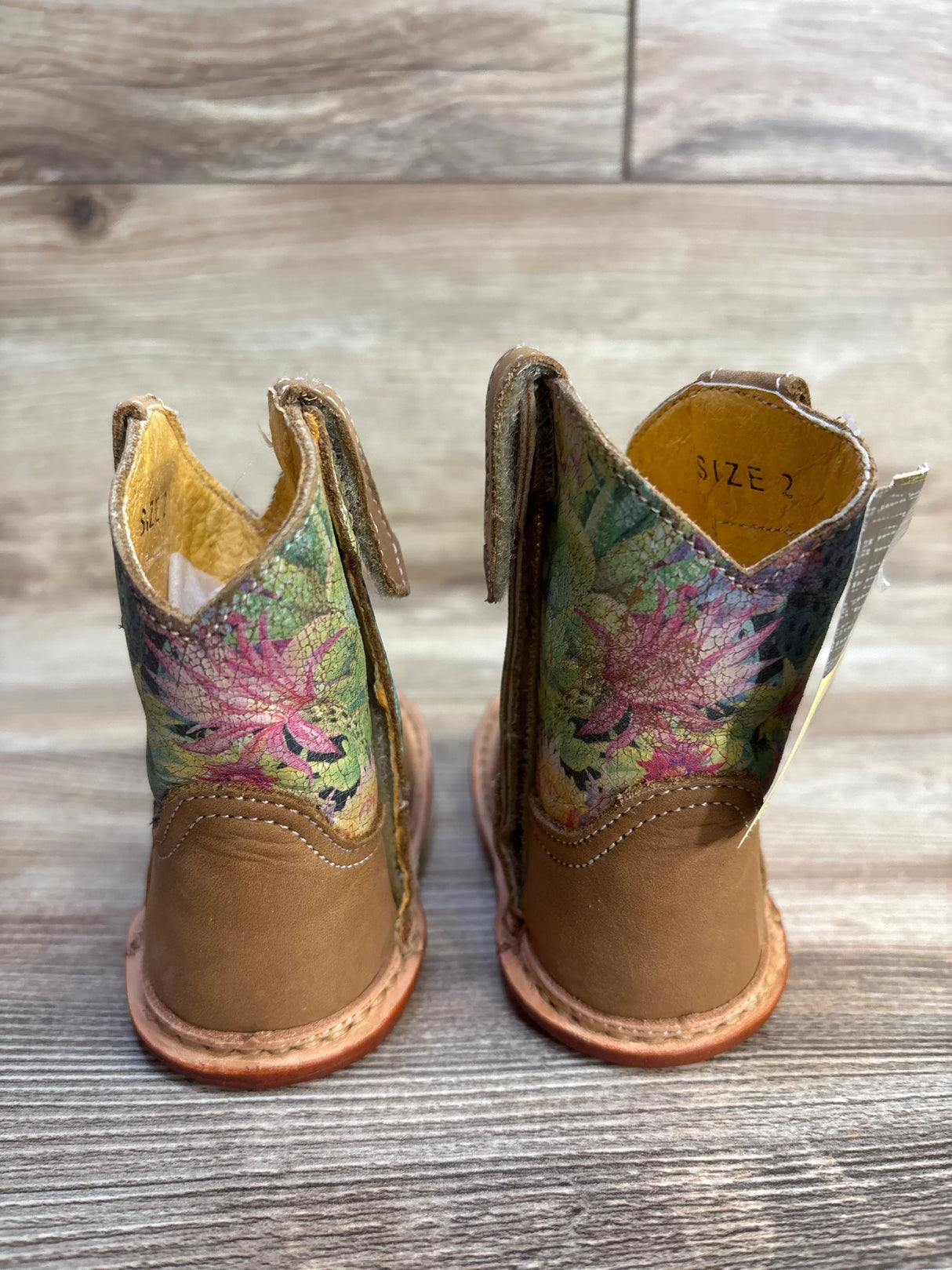 Size 2 toddler cowboy boots with brown leather and colorful floral pattern