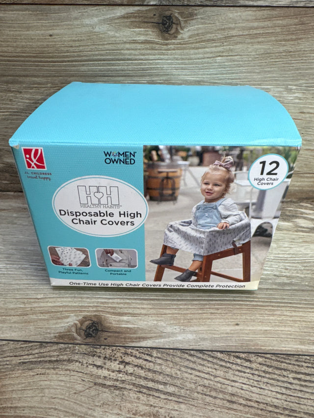 Front view of boxed J.L. Childress disposable high chair covers showing toddler photo and 12-count badge on wood background