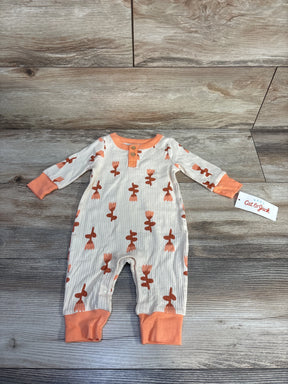 Baby Cat & Jack long-sleeve ribbed romper with orange floral print and cuffs on wooden floor