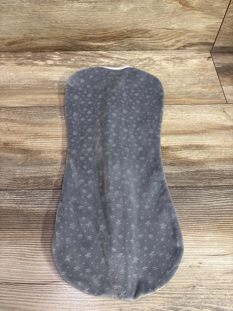Top view of grey SwaddleMe Velboa Swaddle Pod, newborn size, showcasing raised star pattern on a wood-grain background