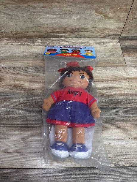 Front view of Angry washable doll in clear packaging on wood-grain surface, wearing red shirt labeled Angry