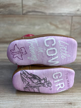Pink baby cowgirl boots with 'Little Cowgirl in Training' text and western illustrations on soles