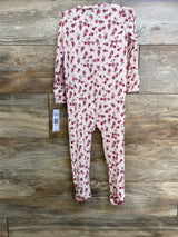 Back view of Betsey Johnson floral sleeper size 3T showing light pink rose print and attached footies on wood background