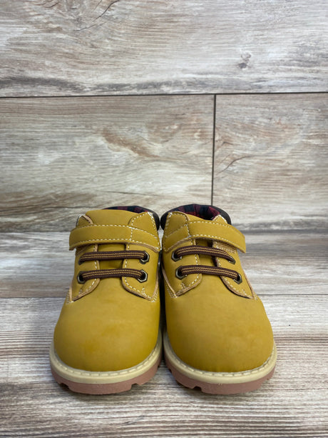 Front view of Garanimals toddler boots (size 6C) showcasing hook-and-loop strap and faux-lace detail with light wood background