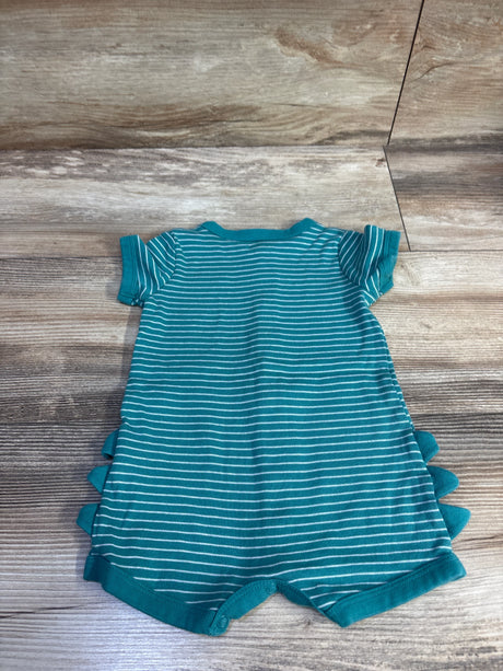 Back flat-lay of teal and white striped baby romper showcasing short sleeves, dinosaur style fabric spikes, and snap crotch on wood background