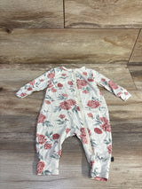 Front flat lay of ivory footless baby sleeper showcasing pink floral print, front zipper, long sleeves, and cuffed ankles on wood background