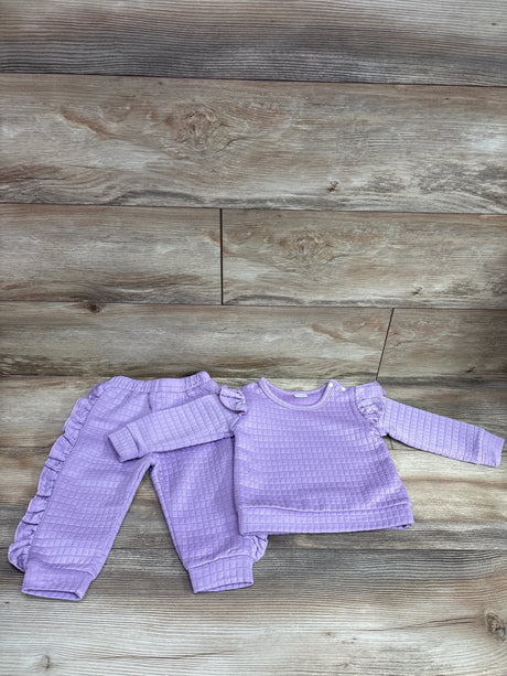 BeMeYourBBs 2pc purple ruffle sweatshirt and joggers set for babies on a wood background