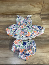 Flat-lay of baby Ralph Lauren 2-piece tropical cotton dress and bloomers showing floral print and ruffled straps
