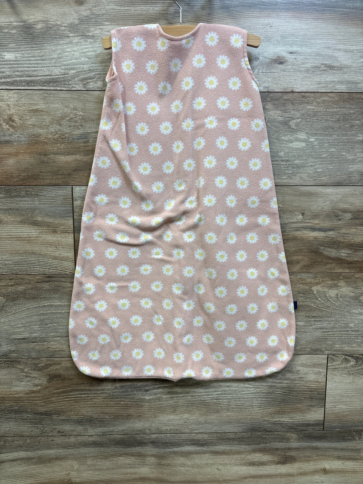 Pink Halo SleepSack blanket with white daisy print, size 6-12m, on a wooden floor.