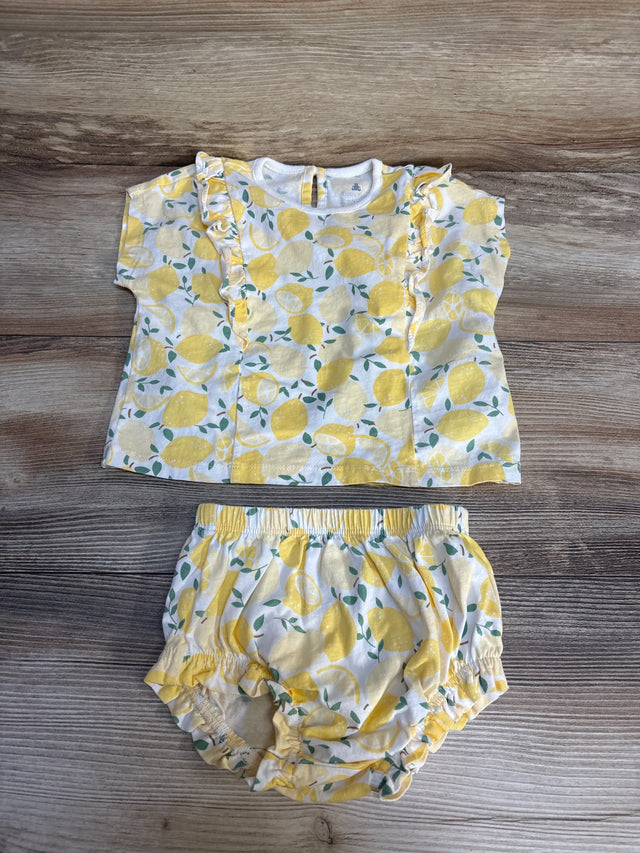 Baby girl lemon print top and bloomers set on wooden background
