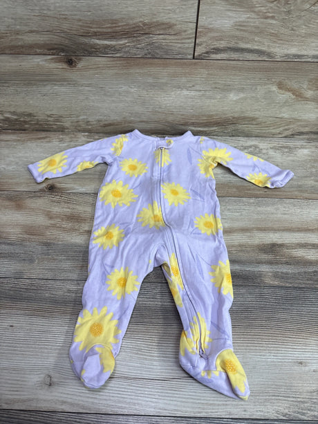 Front view of purple Just One You sleeper with yellow sunflower print and footed legs, laid flat on wood-look floor