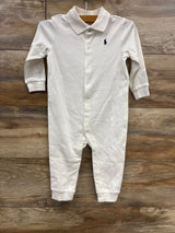 White baby romper with long sleeves, collar, snap buttons, and embroidered logo on chest