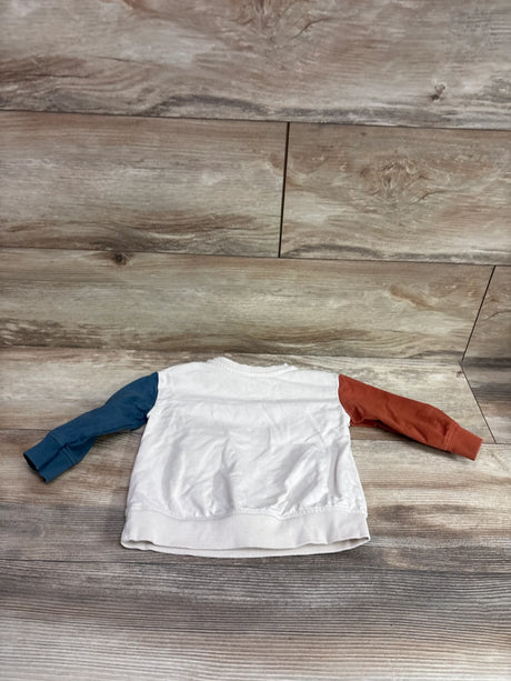 Flat lay of Little Co. American Flag pullover sweatshirt, size 12m, showing beige body, navy and rust sleeves, and ribbed hem
