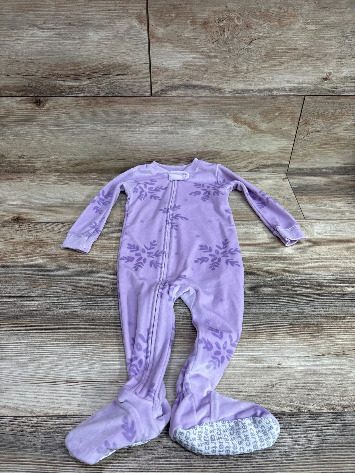Purple Just One You floral print baby blanket sleeper size 12m on a wood background