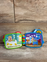 Open Fisher-Price Counting with Puppy electronic book showing bath and bedtime counting pages, colorful hinge on wood floor