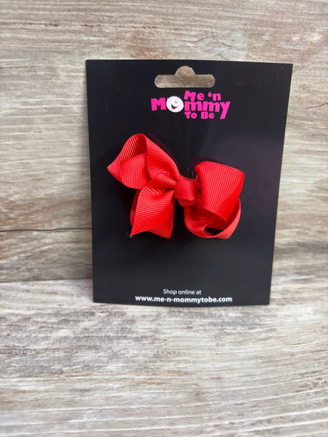 Solid red grosgrain hair bow on a Me n Mommy To Be branded display card
