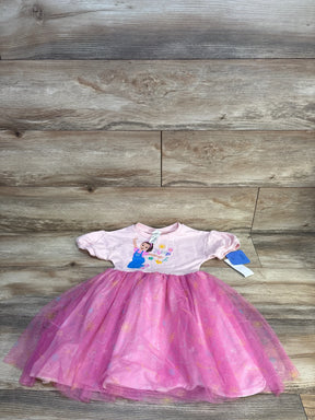 Pink toddler dress with cartoon print and tulle skirt, girl's clothing on wood background