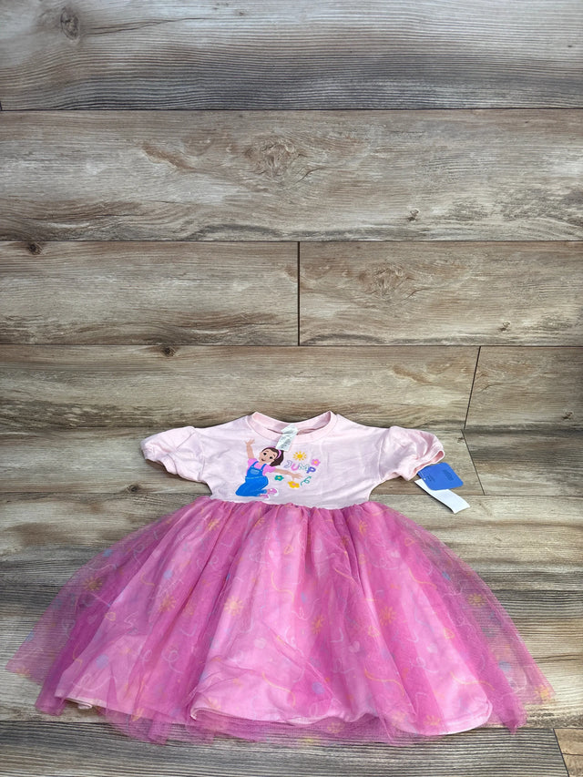 Pink toddler dress with cartoon print and tulle skirt, girl's clothing on wood background