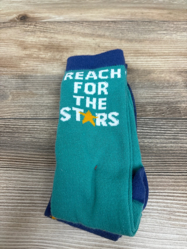 Front view of Cat & Jack knee-high socks showcasing teal fabric, navy trim, and Reach for the Stars text on a wood background