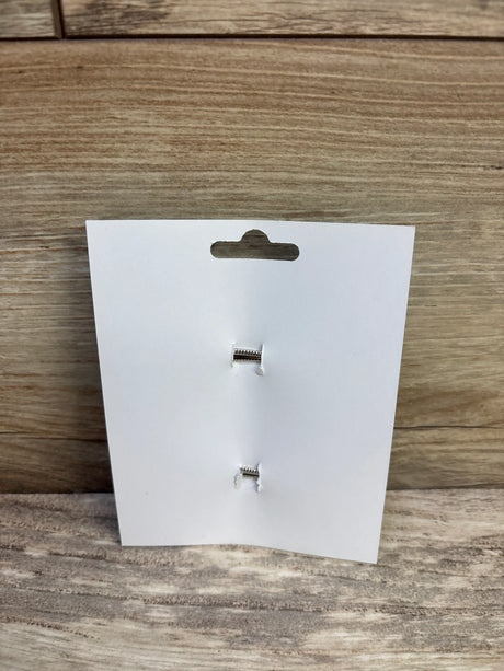 Front view of NEW Hair Bows 2pk Caramel showcasing two silver alligator clips on a white display card against a wood background