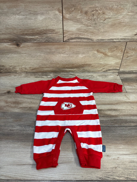 Front view of newborn red-and-white striped Gerber footless coverall with KC Chiefs logo pocket, laid flat on wood floor